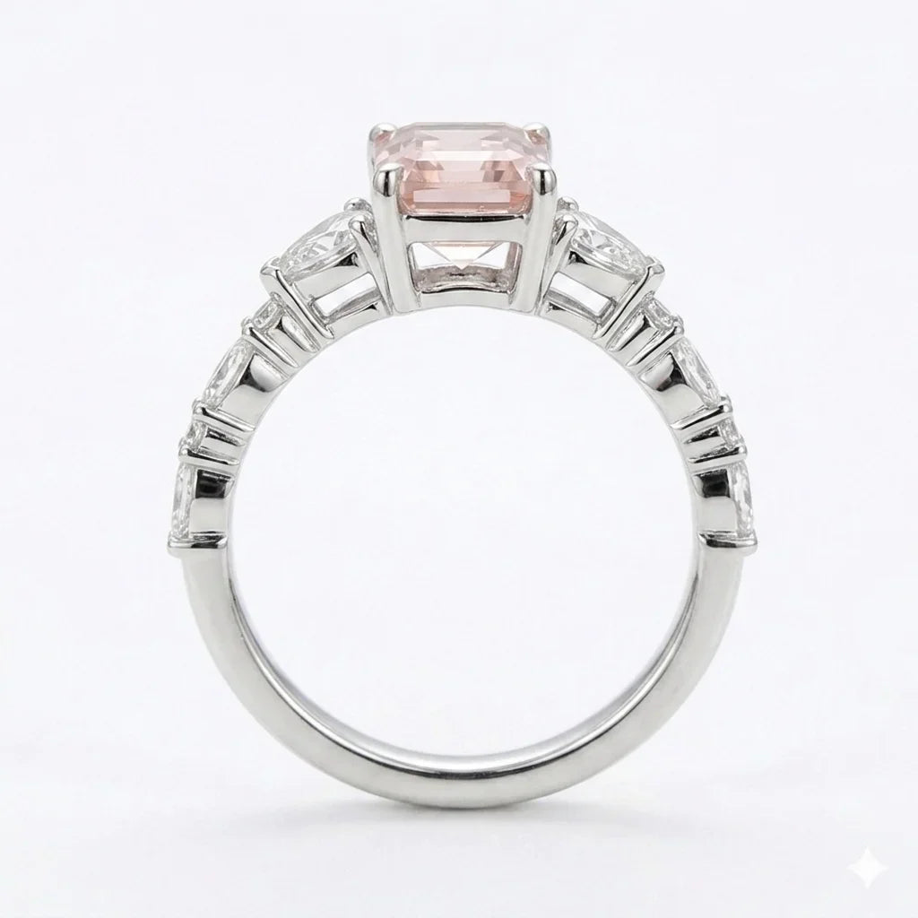 Side view of white gold emerald cut center stone ring with trillion side stones and lab-grown diamonds – Australia