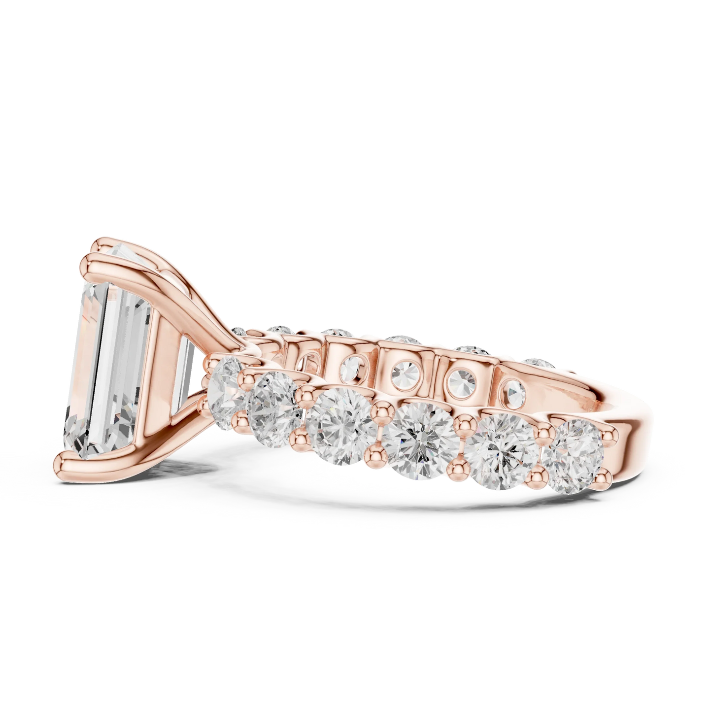 Side profile of rose gold emerald cut solitaire ring with shared prong large stone band and elevated center stone