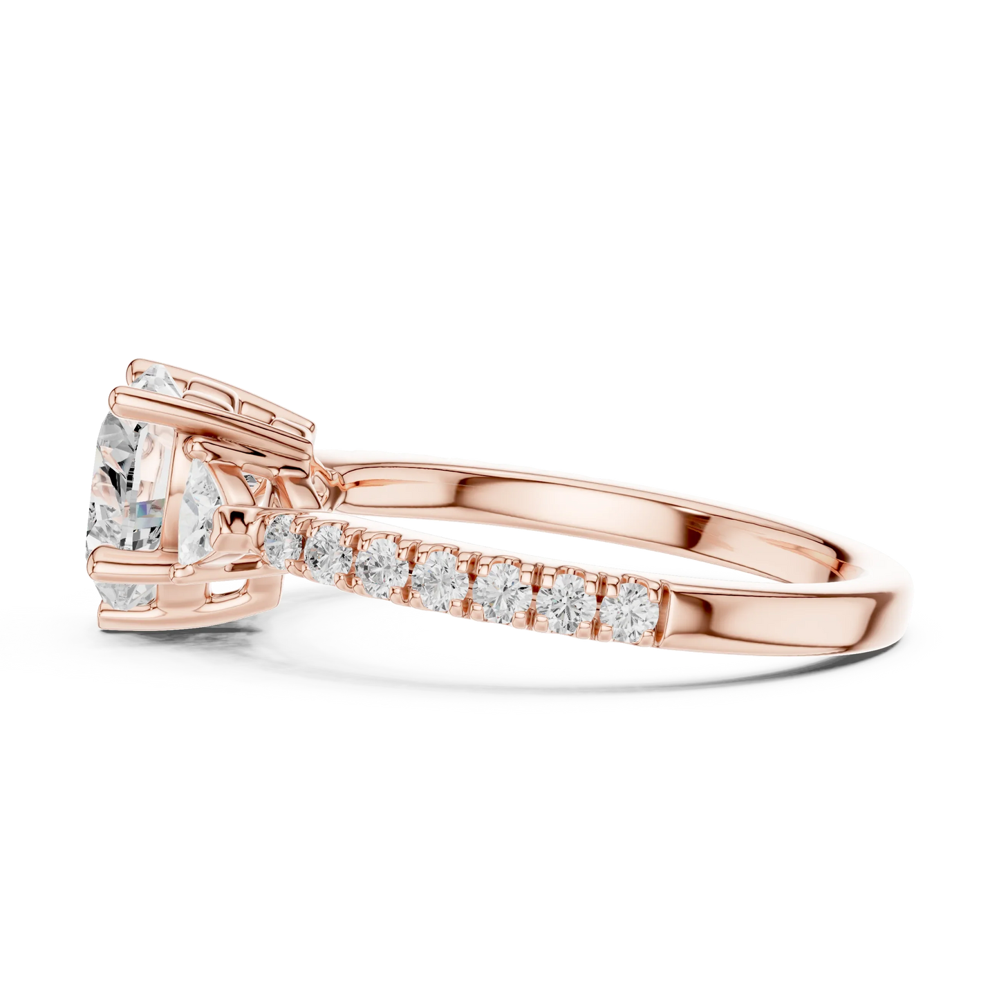 Side view of rose gold heart shape three stone diamond ring with half moon side stones and pave band, highlighting overall design profile.