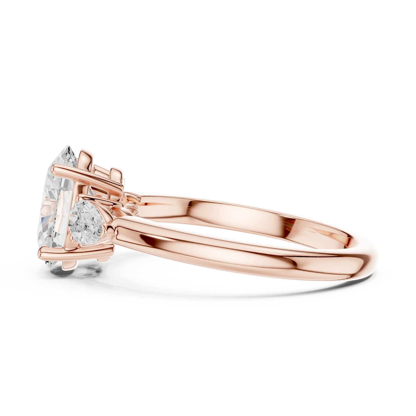 Side view of rose gold oval three-stone ring with pear side stones and lab-grown diamond 鈥?Australia