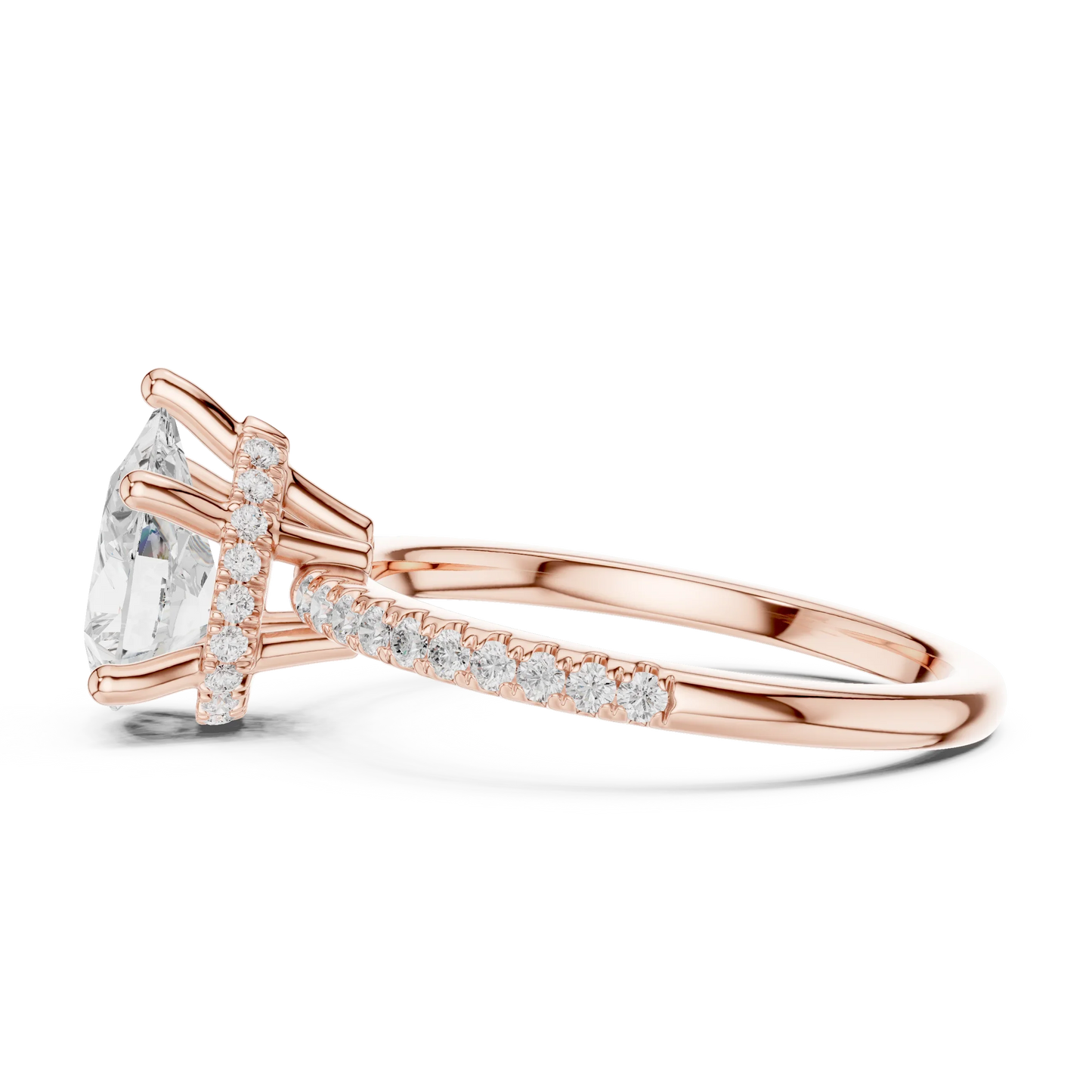Side view of rose gold pear cut solitaire ring highlighting thin pave band and prong setting