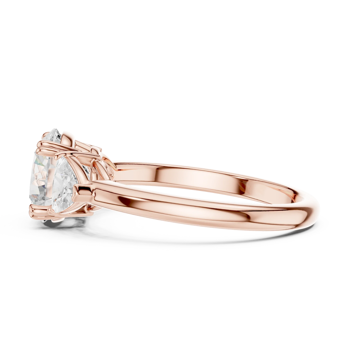 Side view of rose gold round three-stone ring with trillion cut side stones and lab-grown diamond 鈥?Australia