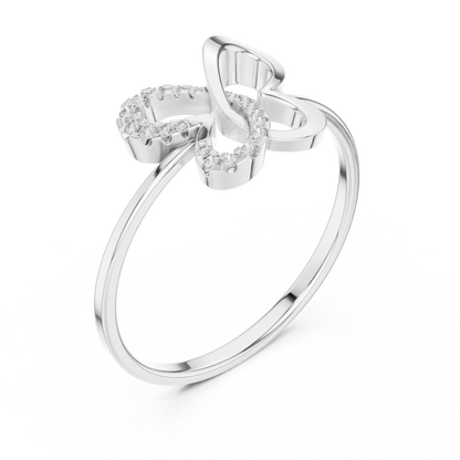 White gold ring with butterfly-shaped diamond design on white background