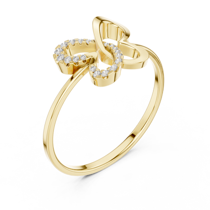 Gold butterfly diamond ring with openwork design and pavé-set diamonds on one wing