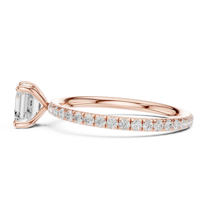 Side profile of rose gold Asscher cut solitaire ring with thin pavé diamond band and elevated center stone