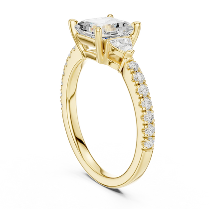 Back side view of yellow gold Asscher three stone diamond pave ring, showing band structure.