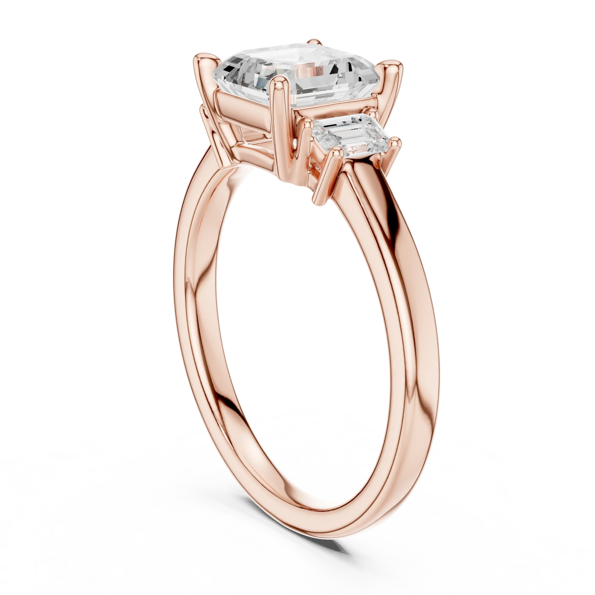 Back side view of rose gold Asscher three stone diamond ring, detailing band and setting.