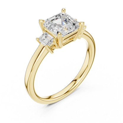 Front view of yellow gold Asscher three stone diamond ring, emphasizing geometric cut and brilliance.