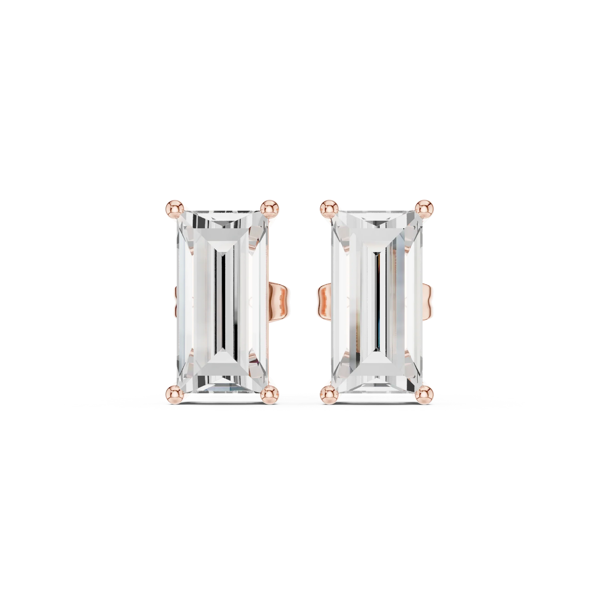 Pair of emerald-cut gemstone earrings with rose gold settings on a white background