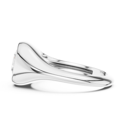 Side view of white gold round cut bezel set signet ring, highlighting smooth profile.
