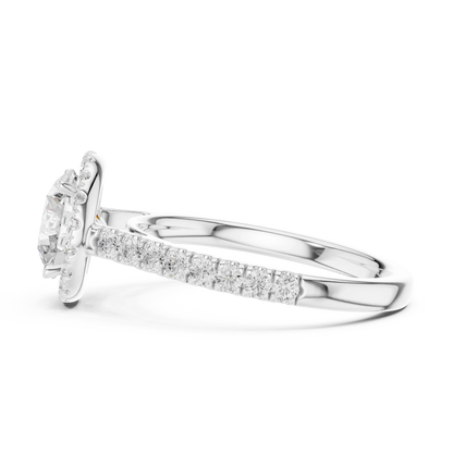 Side view of white gold classic halo round diamond ring showing halo setting and elevated center stone profile