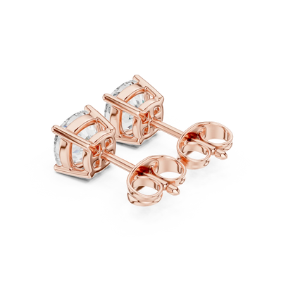 Rose gold earrings with clear gemstones on a white background with back view