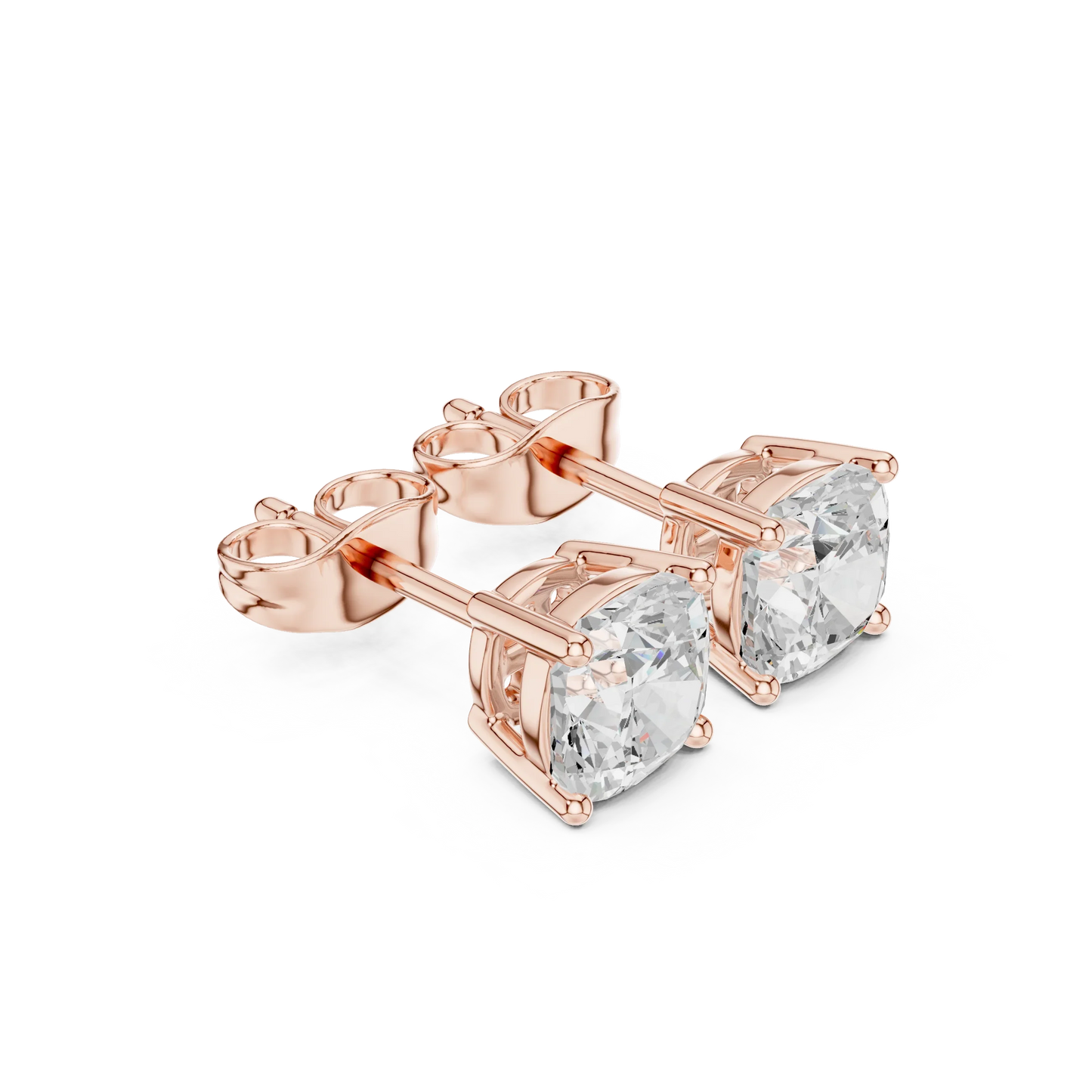 Rose gold earrings with clear gemstones on a white background with top view
