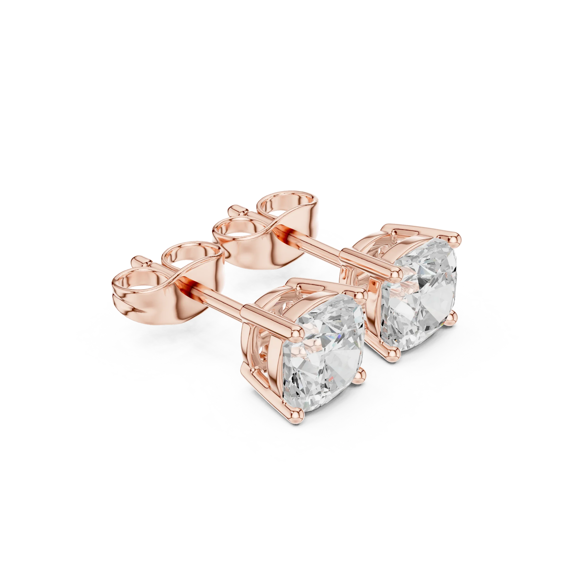 Rose gold earrings with clear gemstones on a white background with top view
