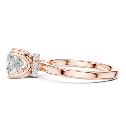 Side view of rose gold cushion cut solitaire ring highlighting hidden halo and domed band design