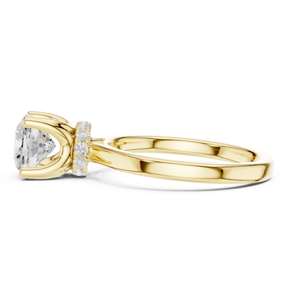 Side view of yellow gold cushion cut solitaire ring highlighting hidden halo and domed band design