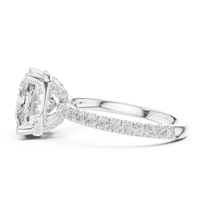 Side view of white gold cushion cut solitaire ring highlighting hidden halo and thin pav茅 band design