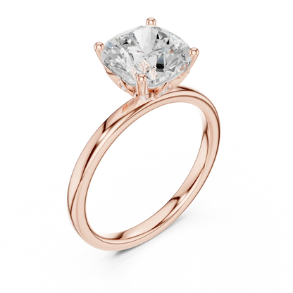 Front view of rose gold cushion cut solitaire ring with domed band and center stone