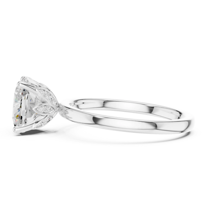 Side view of white gold cushion cut solitaire ring with domed band and raised setting