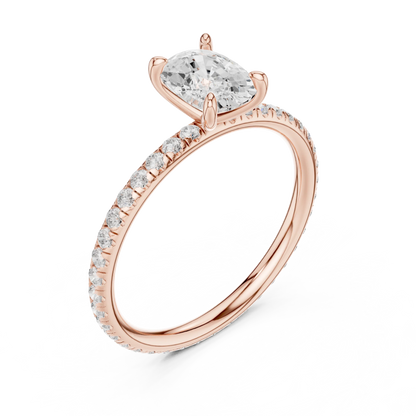 Front view of rose gold cushion cut solitaire ring with thin pavé diamond band and center stone