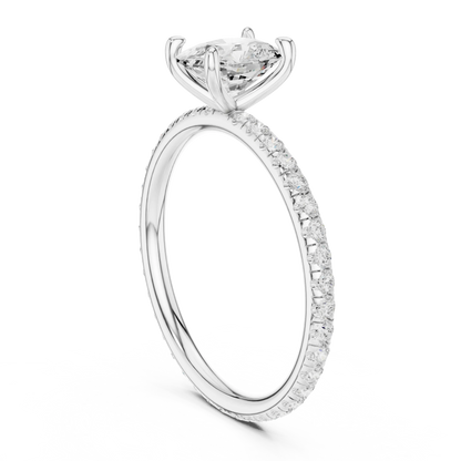 Back side view of white gold cushion cut solitaire ring showing pavé band and setting details