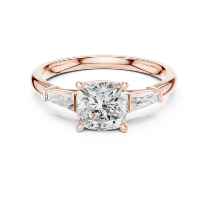 Rose gold cushion three-stone ring with tapered baguette side stones