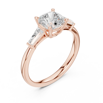 Rose gold cushion three-stone ring with tapered baguette side stones front view
