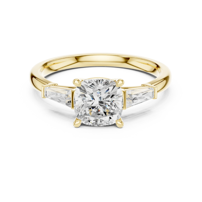 Yellow gold cushion three-stone ring with tapered baguette side stones