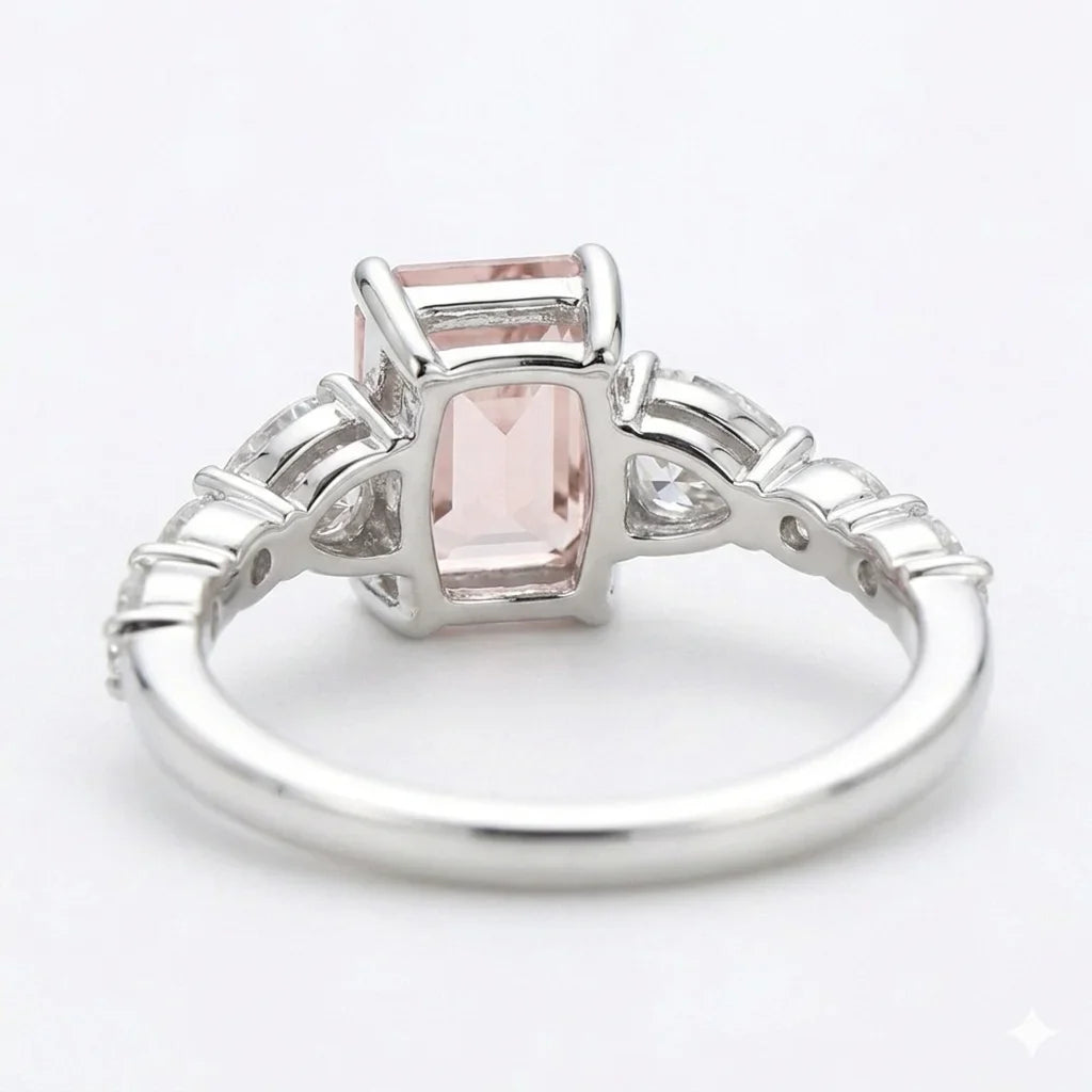 Back view of white gold emerald cut center stone ring with trillion side stones and lab-grown diamonds – Australia