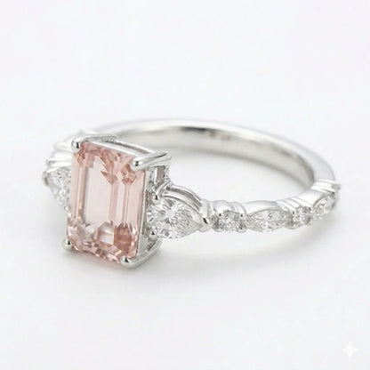 Left side view of white gold emerald cut center stone ring with trillion side stones and lab-grown diamonds – Australia