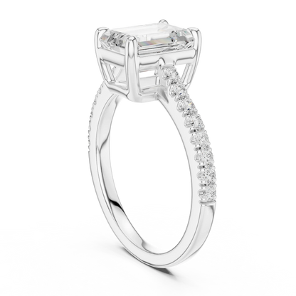 Back side view of white gold emerald-cut diamond pavé band ring showing band and setting details
