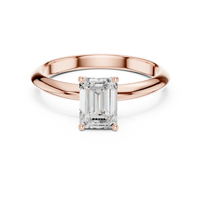 Lab-grown emerald cut diamond solitaire ring in rose gold, soft tone top view.