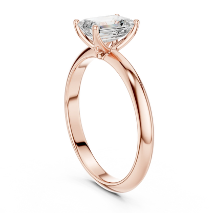 Back view of rose gold emerald diamond solitaire ring, showing band and setting detail