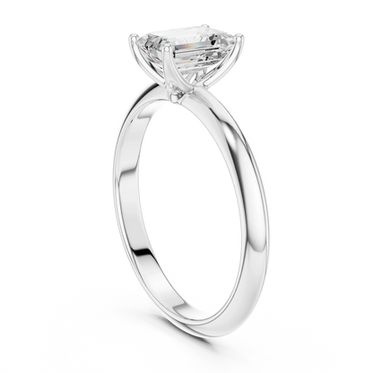 Back side view of white gold emerald diamond solitaire ring, showing band and setting.