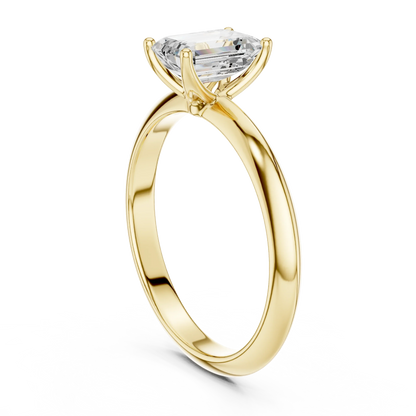 Back side view of yellow gold emerald diamond solitaire ring, showing band structure
