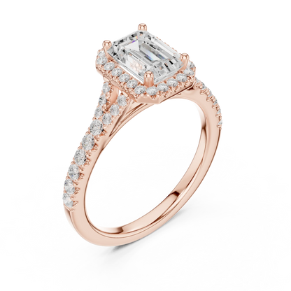 Front view of rose gold emerald halo ring with pavé split shank band and center diamond
