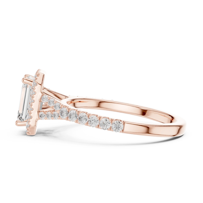 Side profile of rose gold emerald halo ring with pavé split shank band and elevated halo setting