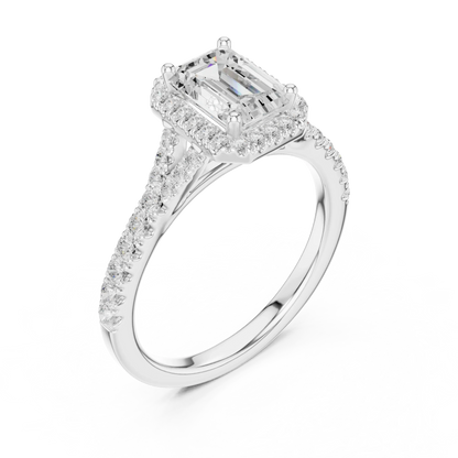 Front view of white gold emerald halo ring with pavé split shank band and center diamond