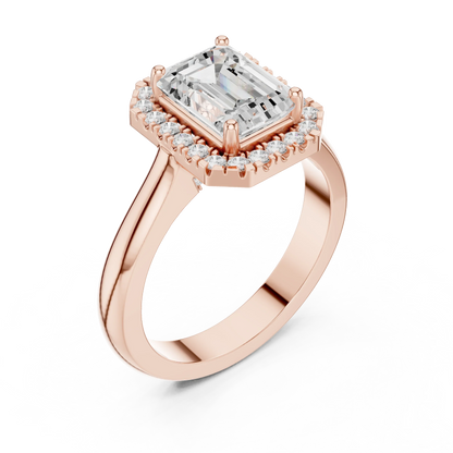 Front view of rose gold emerald halo ring featuring lab-grown diamond with halo setting