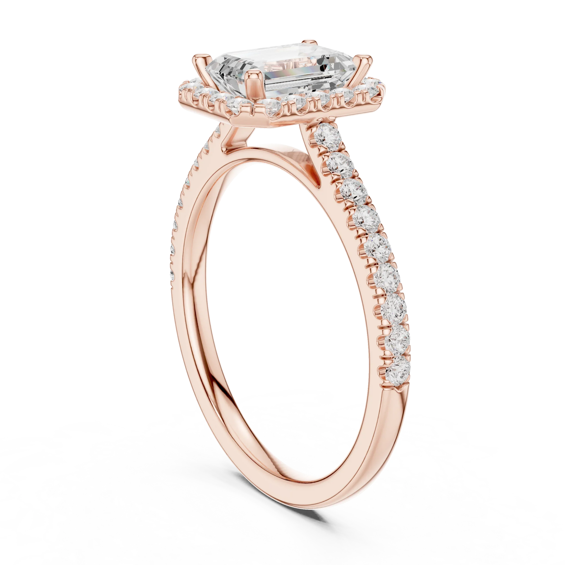Top Side view of rose gold emerald-cut halo ring with pav茅 diamond band and lab-grown center stone