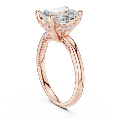 Back side view of rose gold emerald cut solitaire ring showing hidden halo and domed band structure
