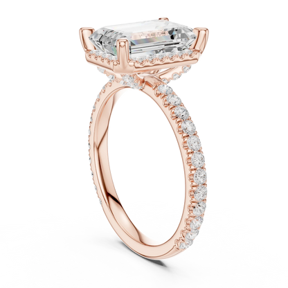 Back side view of rose gold emerald cut solitaire ring showing hidden halo and thin pav茅 band structure