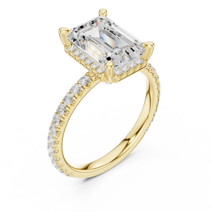 Front view of yellow gold emerald cut solitaire ring with hidden halo and thin pav茅 diamond band and lab-created diamond