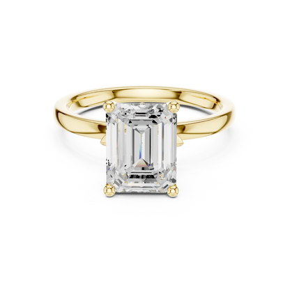 Lab-grown emerald cut solitaire ring in yellow gold with smooth domed band
