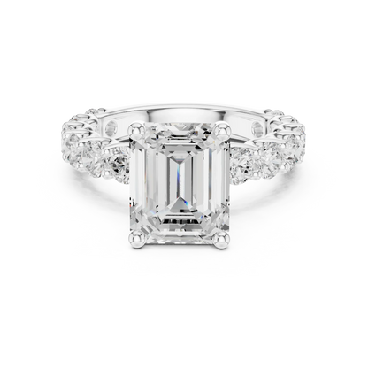 Lab-grown emerald cut solitaire ring in white gold with shared prong large stone band