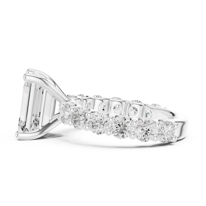 Side view of white gold emerald cut solitaire ring with shared prong large stone band and elevated setting