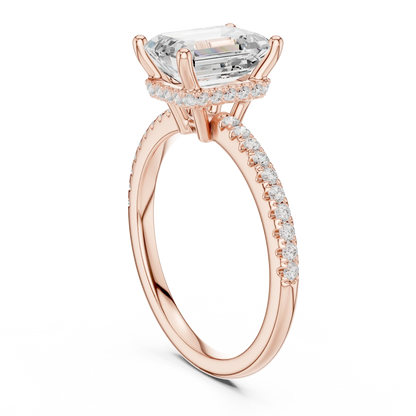 Back side view of rose gold emerald cut solitaire ring showing thin pave band and setting structure