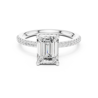 White gold emerald cut solitaire ring with thin pave band and lab-grown diamond, sleek elegant design