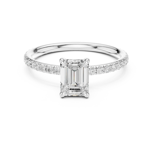 Lab-grown emerald cut solitaire ring in white gold with thin pavé diamond band
