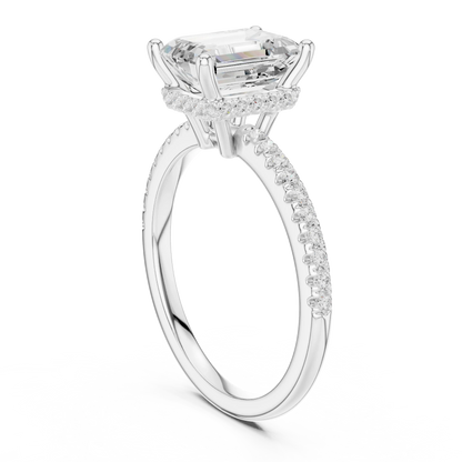 Back side view of white gold emerald cut solitaire ring showing thin pave band and setting details
